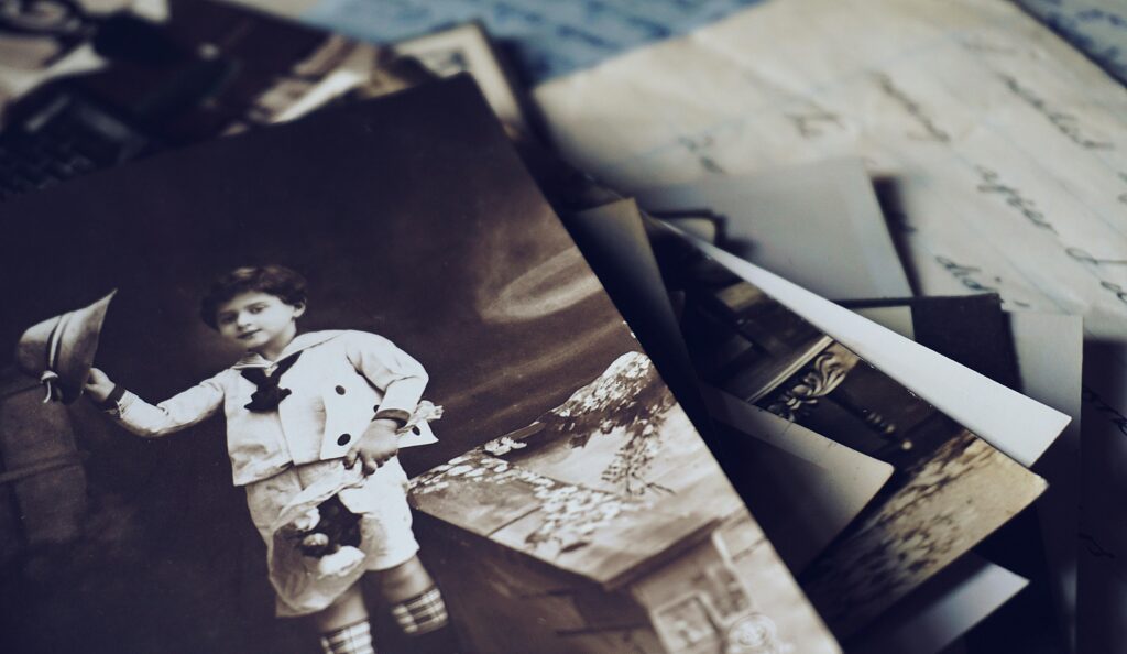 pexels photo 2061915 2061915 A nostalgic close-up of vintage photos and letters revealing memories from the past.