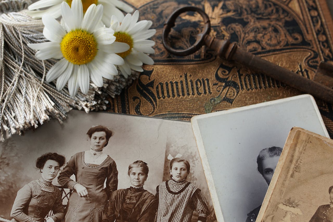 home-hero Vintage family photographs with daisies and an antique key evoke memories and nostalgia.